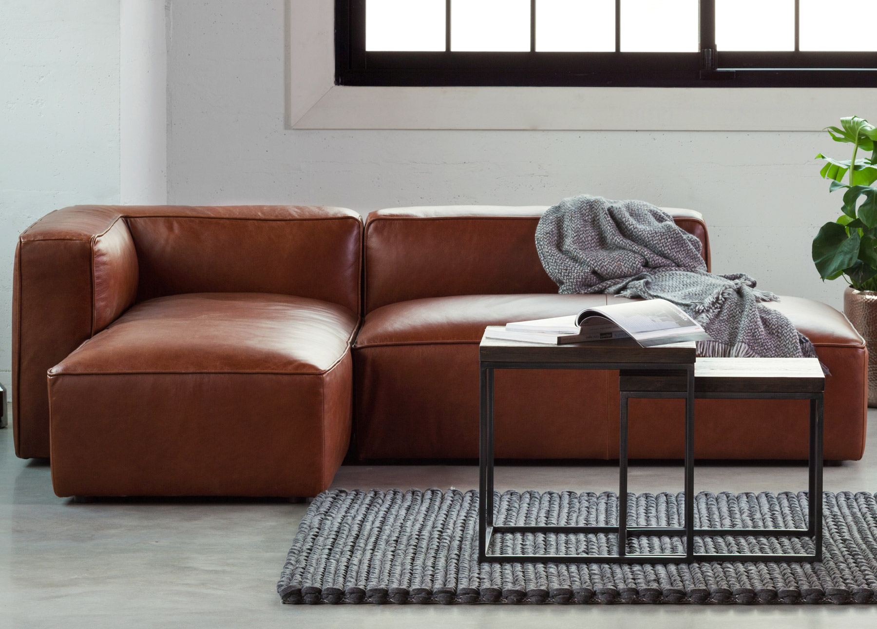 Mello Taos Brown left sectional sofa with coffee tables and rug