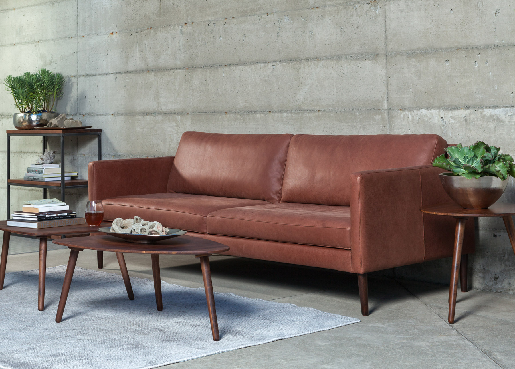 Echo Primo Sedona Brown Sofa with rug, coffee tables, and side table